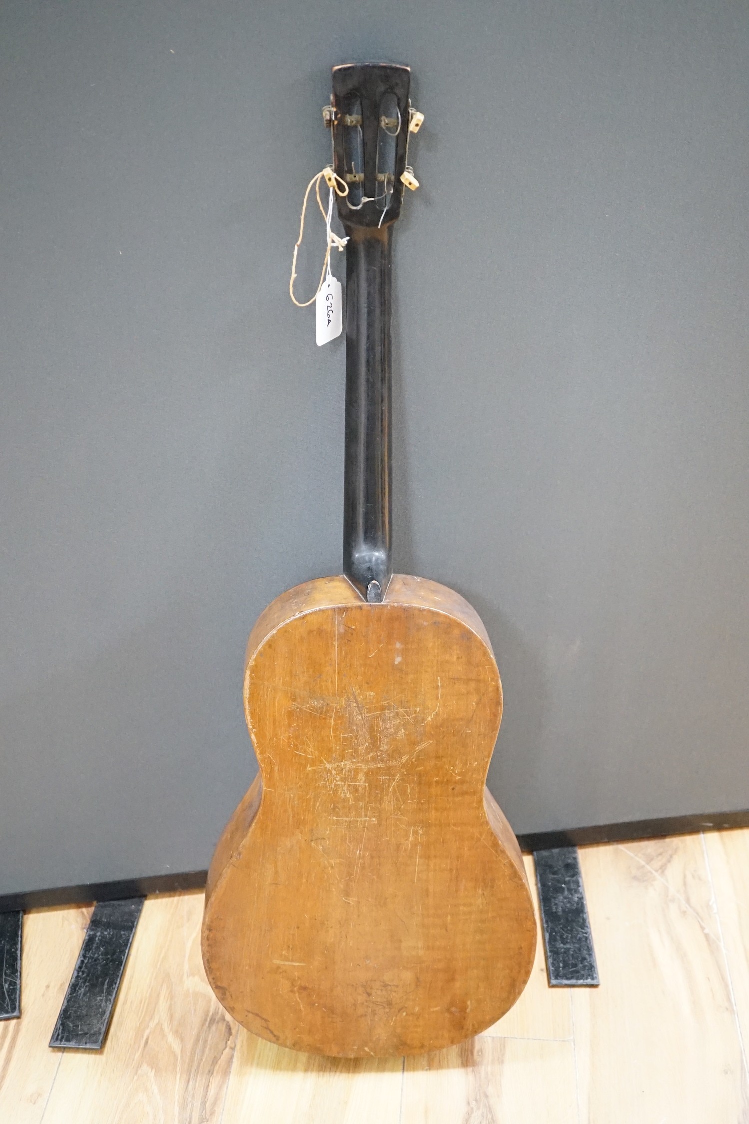 A four string banjo style parlour guitar